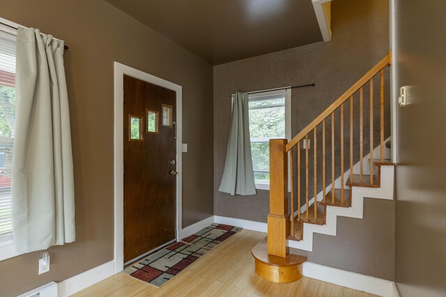 318 Cecil St, Buchanan, MI 49107 - entryway with stairs and wood finished floors
