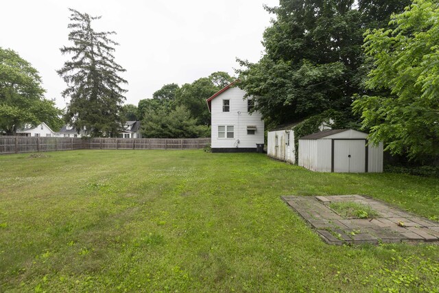 318 Cecil St, Buchanan, MI 49107 - fenced backyard featuring a shed