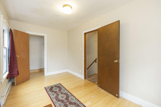 318 Cecil St, Buchanan, MI 49107 - spare room featuring baseboard heating and light wood finished floors