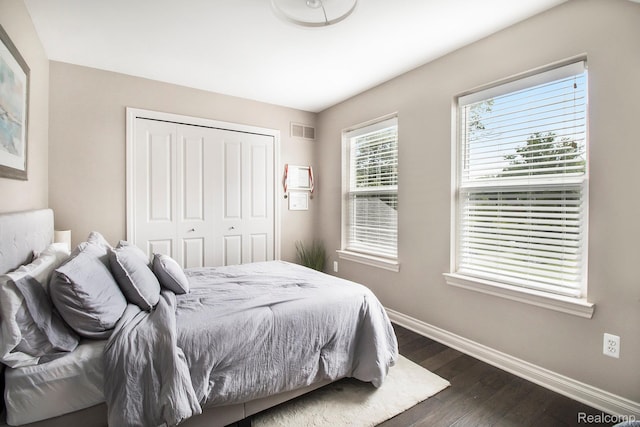 22085 Thorofare Rd, Grosse Ile, MI 48138 - bedroom with dark wood-style floors and a closet