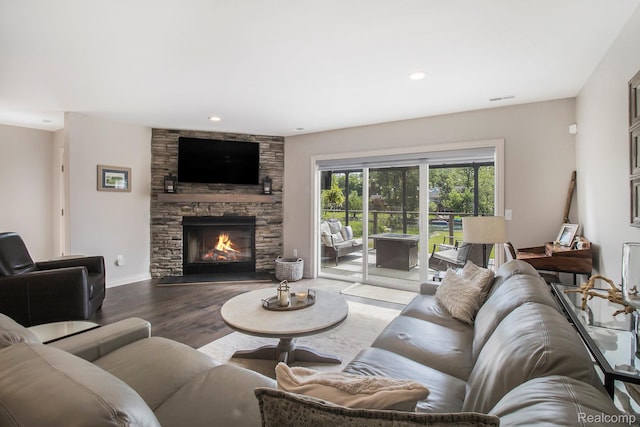 22085 Thorofare Rd, Grosse Ile, MI 48138 - living area with wood finished floors, a stone fireplace, and recessed lighting