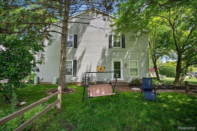 17013 Smugglers Cove St, Clinton Township, MI 48038 - rear view of property featuring a yard