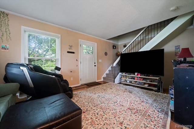 17013 Smugglers Cove St, Clinton Township, MI 48038 - living area featuring stairs, crown molding, and wood finished floors