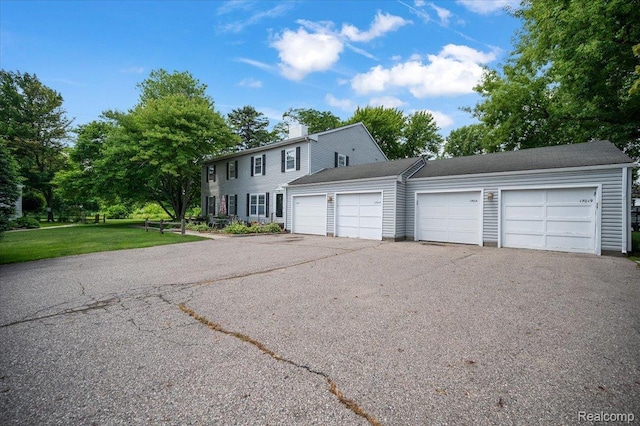 17013 Smugglers Cove St, Clinton Township, MI 48038 - colonial house with a chimney and a front lawn