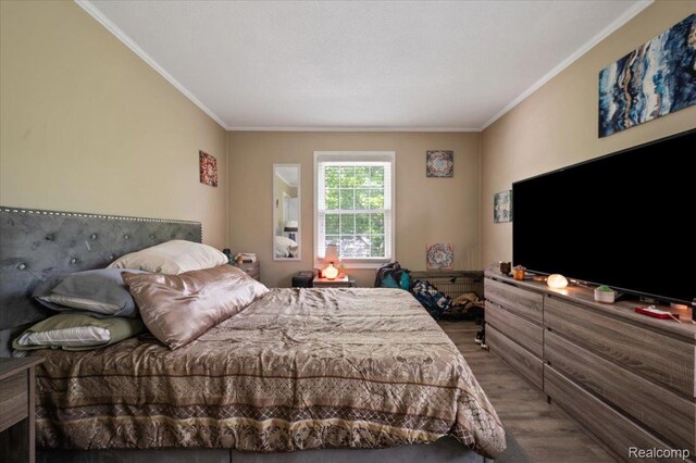 17013 Smugglers Cove St, Clinton Township, MI 48038 - bedroom with wood finished floors and crown molding