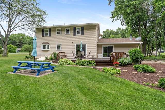 3125 Fawn Ln, Jackson, MI 49201 - back of property with a yard and a deck