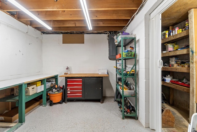 3125 Fawn Ln, Jackson, MI 49201 - unfinished below grade area featuring a workshop area and concrete block wall