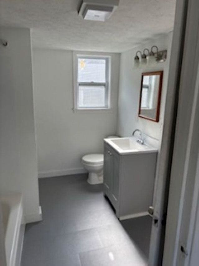 1431 Cleveland St, Owosso, MI 48867 - full bath with vanity and a tub to relax in