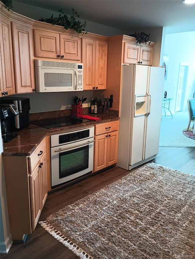 50703 Harbour View Dr N, New Baltimore, MI 48047 - kitchen featuring white appliances, dark wood-style flooring, and dark stone counters