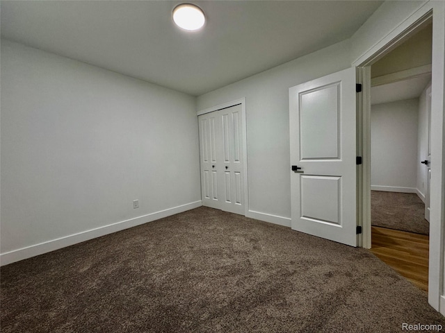 297 W Yale Ave, Pontiac, MI 48340 - unfurnished bedroom with dark colored carpet and a closet