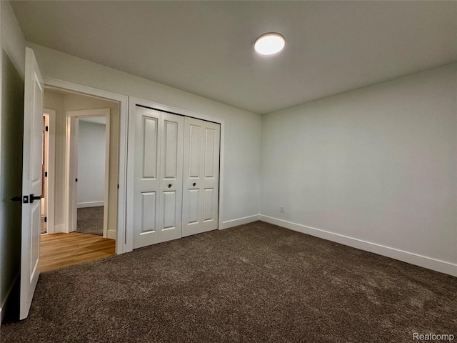 297 W Yale Ave, Pontiac, MI 48340 - unfurnished bedroom featuring dark carpet and a closet
