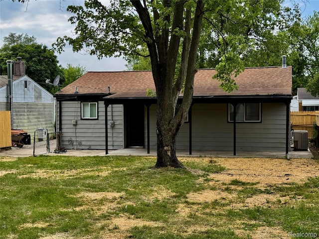297 W Yale Ave, Pontiac, MI 48340 - back of house with a shingled roof and a patio