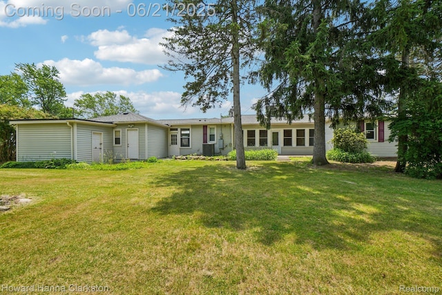 5766 Corunna Ave, Clarkston, MI 48346 - back of house featuring a lawn