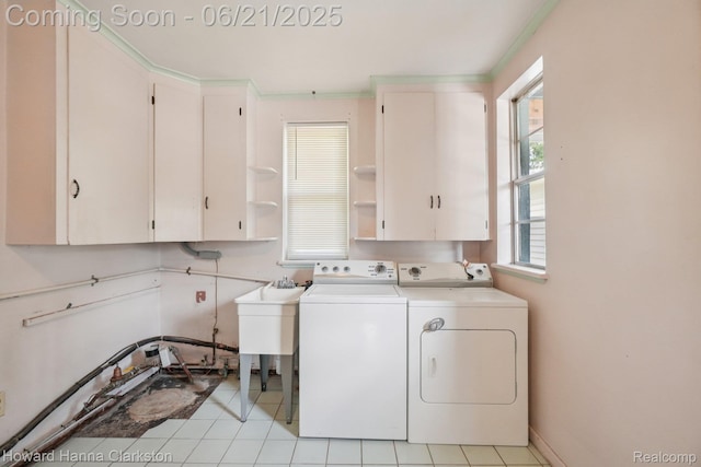 5766 Corunna Ave, Clarkston, MI 48346 - laundry room with cabinet space, separate washer and dryer, and light tile patterned flooring