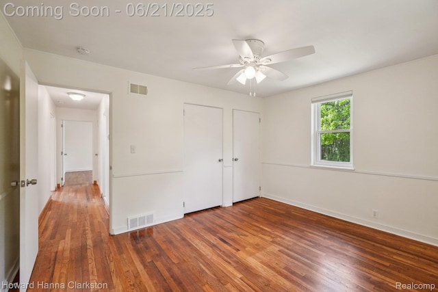 5766 Corunna Ave, Clarkston, MI 48346 - unfurnished bedroom featuring wood finished floors and a ceiling fan