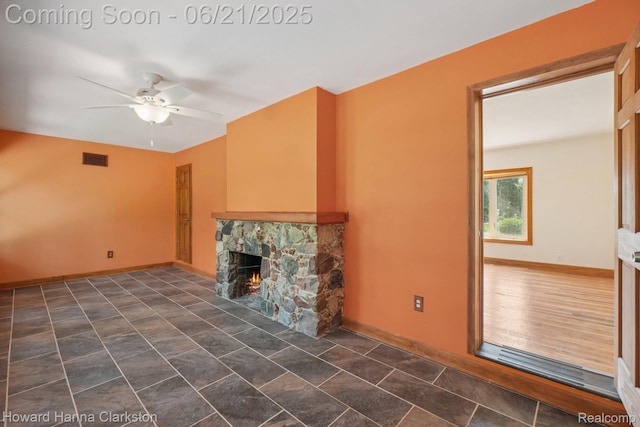 5766 Corunna Ave, Clarkston, MI 48346 - unfurnished living room with ceiling fan and a fireplace