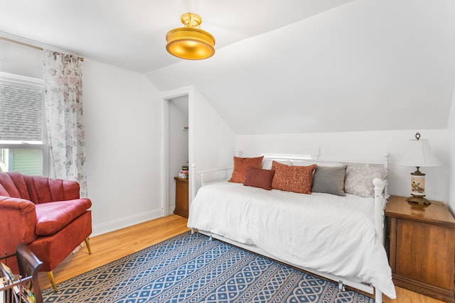317 Cherry St, South Haven, MI 49090 - bedroom featuring wood finished floors and vaulted ceiling