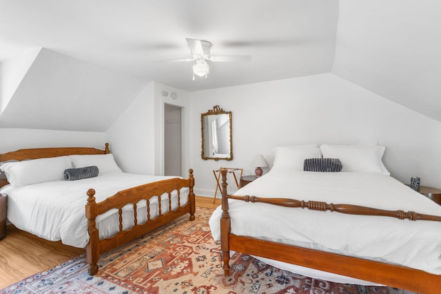 317 Cherry St, South Haven, MI 49090 - bedroom with lofted ceiling, a ceiling fan, and wood finished floors
