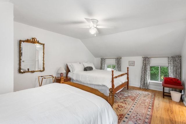 317 Cherry St, South Haven, MI 49090 - bedroom featuring multiple windows, light wood-type flooring, vaulted ceiling, and a ceiling fan