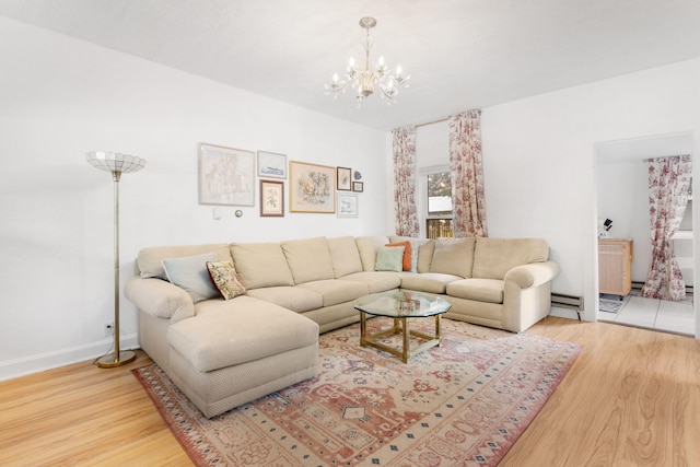 317 Cherry St, South Haven, MI 49090 - living area with wood finished floors, a chandelier, and a baseboard heating unit