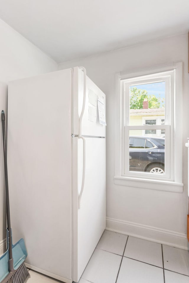 317 Cherry St, South Haven, MI 49090 - kitchen featuring freestanding refrigerator and light tile patterned floors