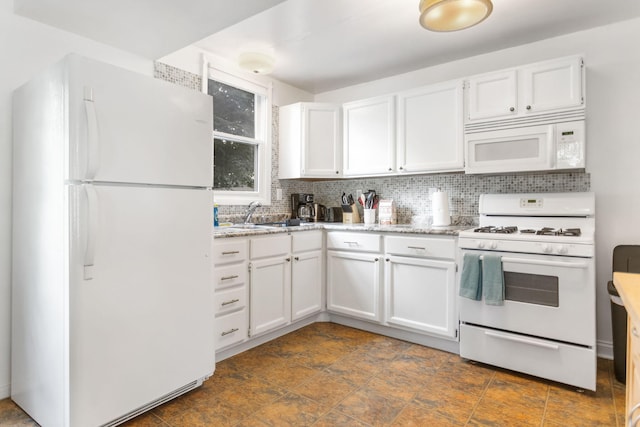 317 Cherry St, South Haven, MI 49090 - kitchen featuring white appliances, white cabinetry, decorative backsplash, and light stone countertops