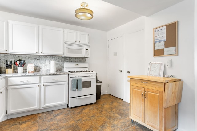317 Cherry St, South Haven, MI 49090 - kitchen featuring white appliances, white cabinets, decorative backsplash, and light stone countertops