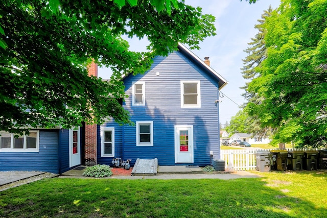 317 Cherry St, South Haven, MI 49090 - rear view of house featuring a chimney