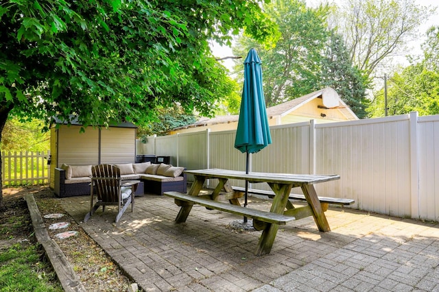 317 Cherry St, South Haven, MI 49090 - fenced backyard featuring outdoor dining area, an outdoor living space, a patio, and an outdoor structure