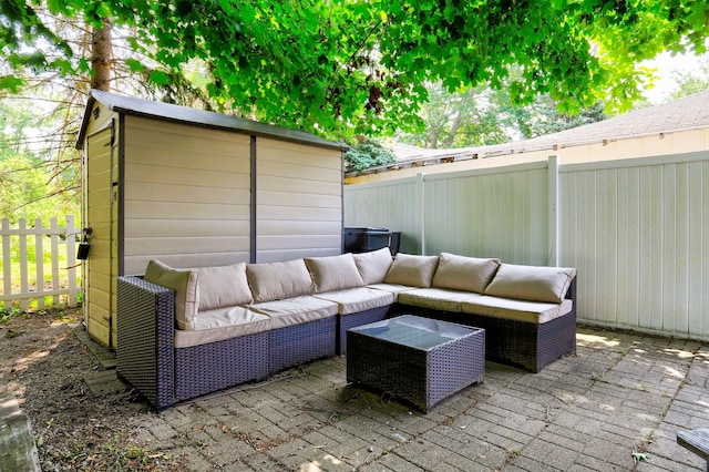 317 Cherry St, South Haven, MI 49090 - fenced backyard featuring an outdoor living space, a patio, and a storage unit