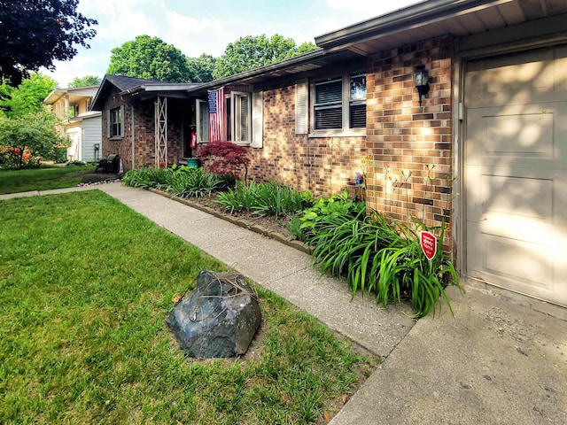 424 Leland St, Flushing, MI 48433 - single story home with brick siding and a front lawn