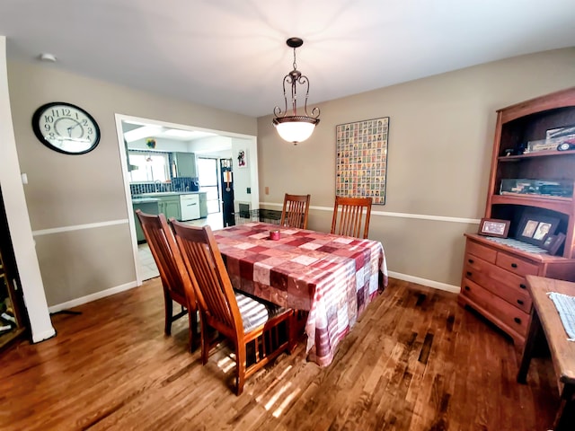 424 Leland St, Flushing, MI 48433 - dining space with wood finished floors and baseboards
