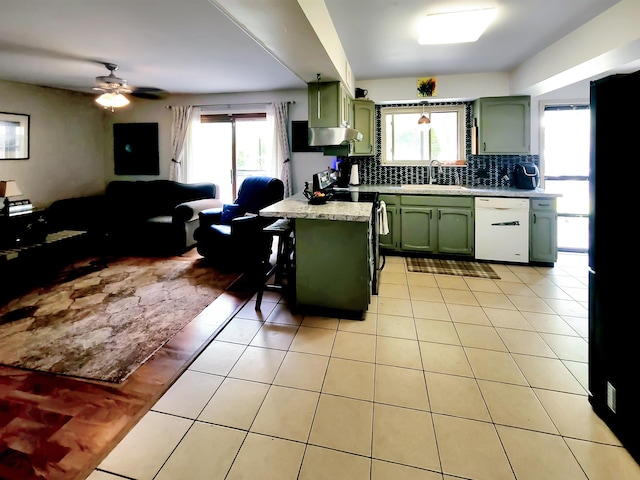 424 Leland St, Flushing, MI 48433 - kitchen featuring green cabinetry, dishwasher, light countertops, backsplash, and ceiling fan
