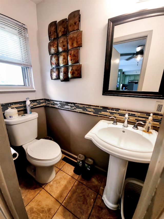 424 Leland St, Flushing, MI 48433 - half bathroom featuring tile patterned flooring, tile walls, and wainscoting