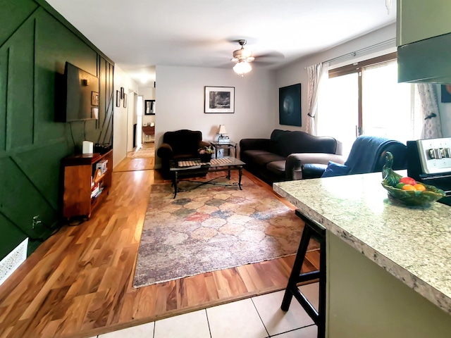 424 Leland St, Flushing, MI 48433 - living room featuring light wood-style floors and ceiling fan