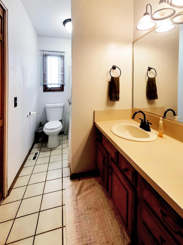 424 Leland St, Flushing, MI 48433 - bathroom with vanity and tile patterned flooring