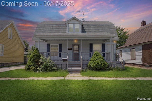 3920 Clark St, Canton, MI 48184 - colonial inspired home featuring covered porch, a lawn, and a shingled roof