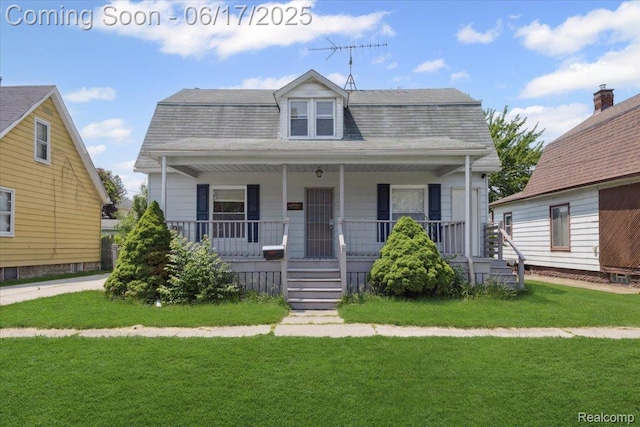 3920 Clark St, Canton, MI 48184 - dutch colonial featuring a porch, a front lawn, and a shingled roof