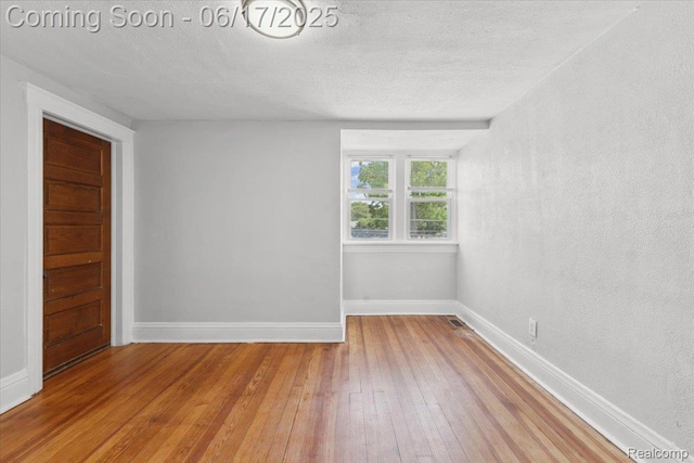 3920 Clark St, Canton, MI 48184 - unfurnished room with hardwood / wood-style floors and a textured ceiling