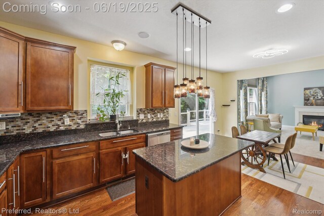 51159 Luke Ln, Novi, MI 48374 - kitchen featuring stainless steel dishwasher, dark wood finished floors, healthy amount of natural light, open floor plan, and recessed lighting