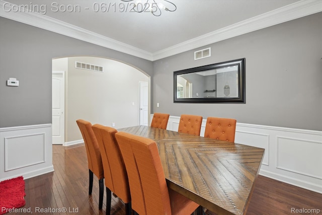 51159 Luke Ln, Novi, MI 48374 - dining space featuring crown molding, arched walkways, wainscoting, hardwood / wood-style flooring, and a decorative wall