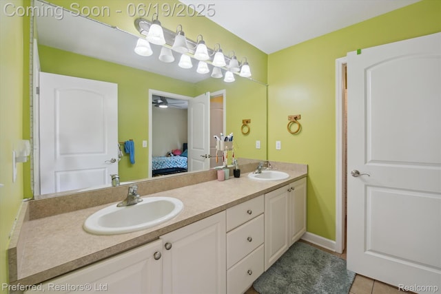 51159 Luke Ln, Novi, MI 48374 - full bath with double vanity, connected bathroom, tile patterned floors, and a ceiling fan