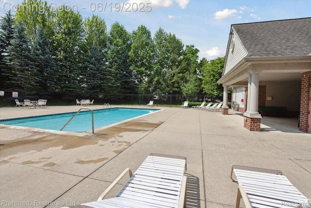 51159 Luke Ln, Novi, MI 48374 - community pool with a patio area and view of wooded area