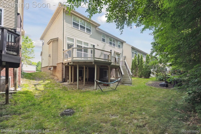 51159 Luke Ln, Novi, MI 48374 - back of property with a wooden deck, a lawn, and stairway