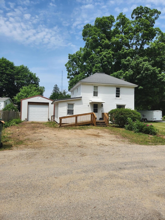 222 Scribner St, Delton, MI 49046 - view of front of property with driveway, a garage, and a deck