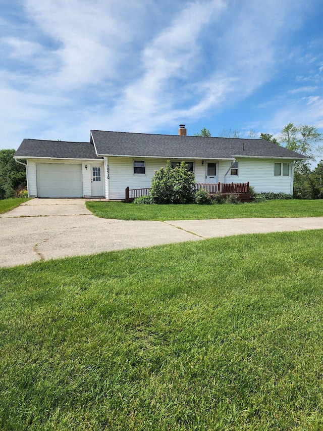 10510 S Hemlock, Brant, MI 48614 - ranch-style home with concrete driveway, an attached garage, a chimney, and a front yard
