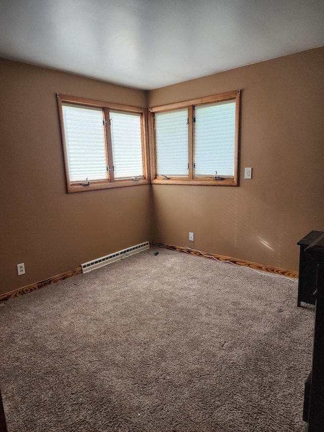10510 S Hemlock, Brant, MI 48614 - carpeted empty room featuring baseboard heating and baseboards