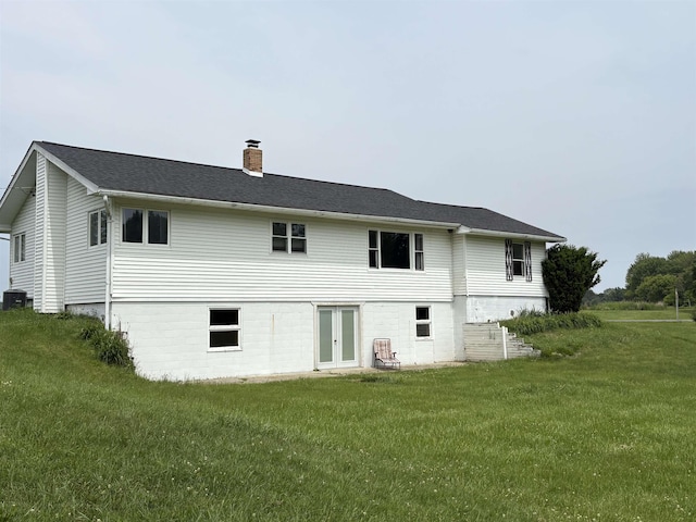 10510 S Hemlock, Brant, MI 48614 - rear view of property with a chimney, french doors, and a lawn