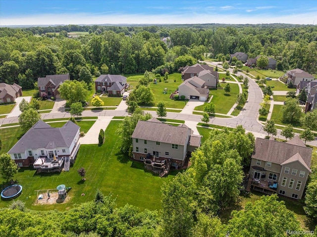 966 Wynstone Cir N, Oakland, MI 48363 - aerial perspective of suburban area with a heavily wooded area