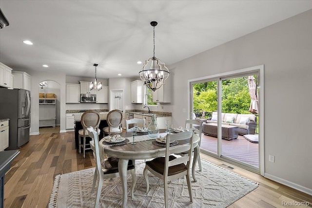 966 Wynstone Cir N, Oakland, MI 48363 - dining space with a chandelier, recessed lighting, and light wood finished floors